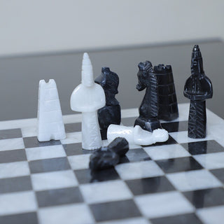 Ancient Egyptian Chess Figures Placing on the white marble chess board